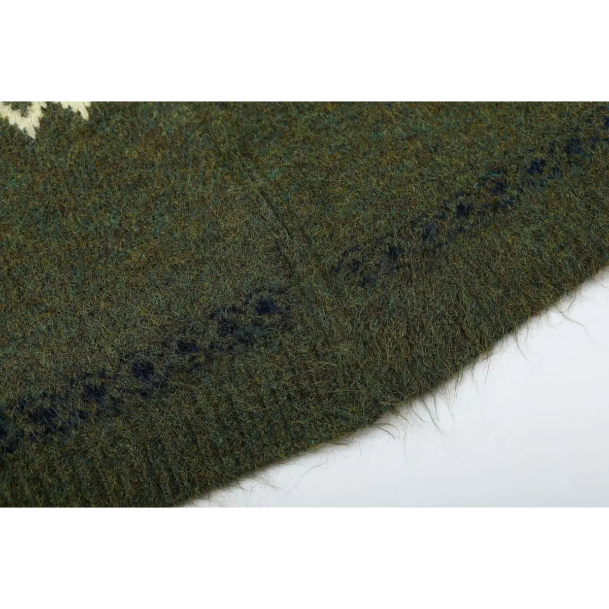 Close-up of fuzzy brushed hem edge and navy stripe