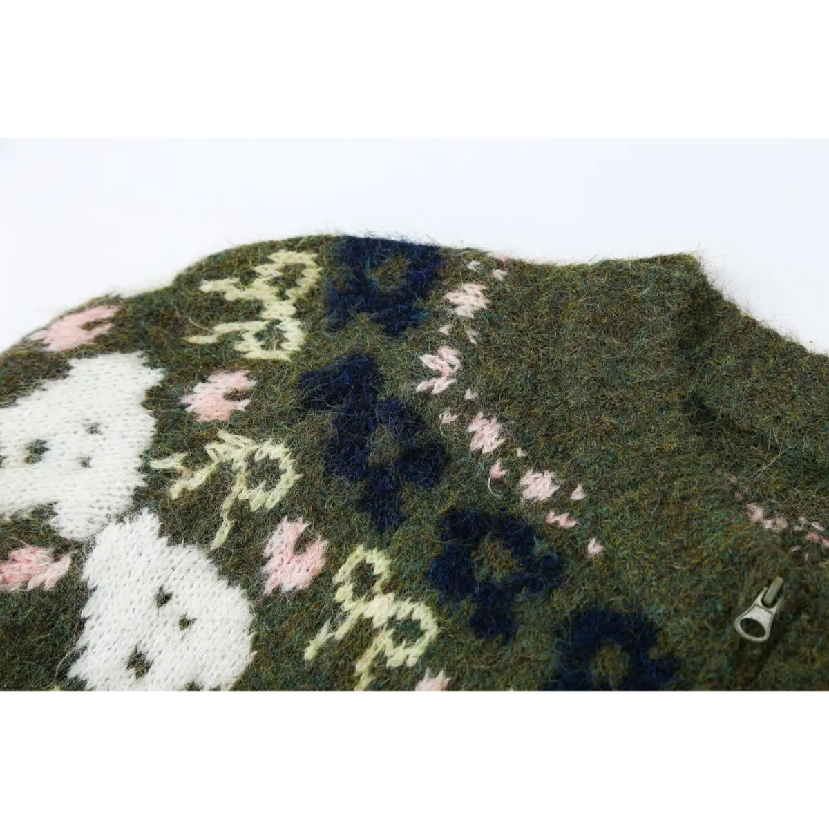 Close-up of shoulder fair Isle yoke with navy flowers and pink dots