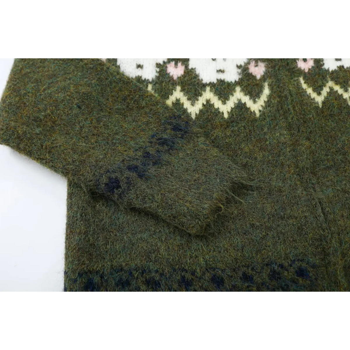 Close-up of sleeve cuff with navy patterned stripe