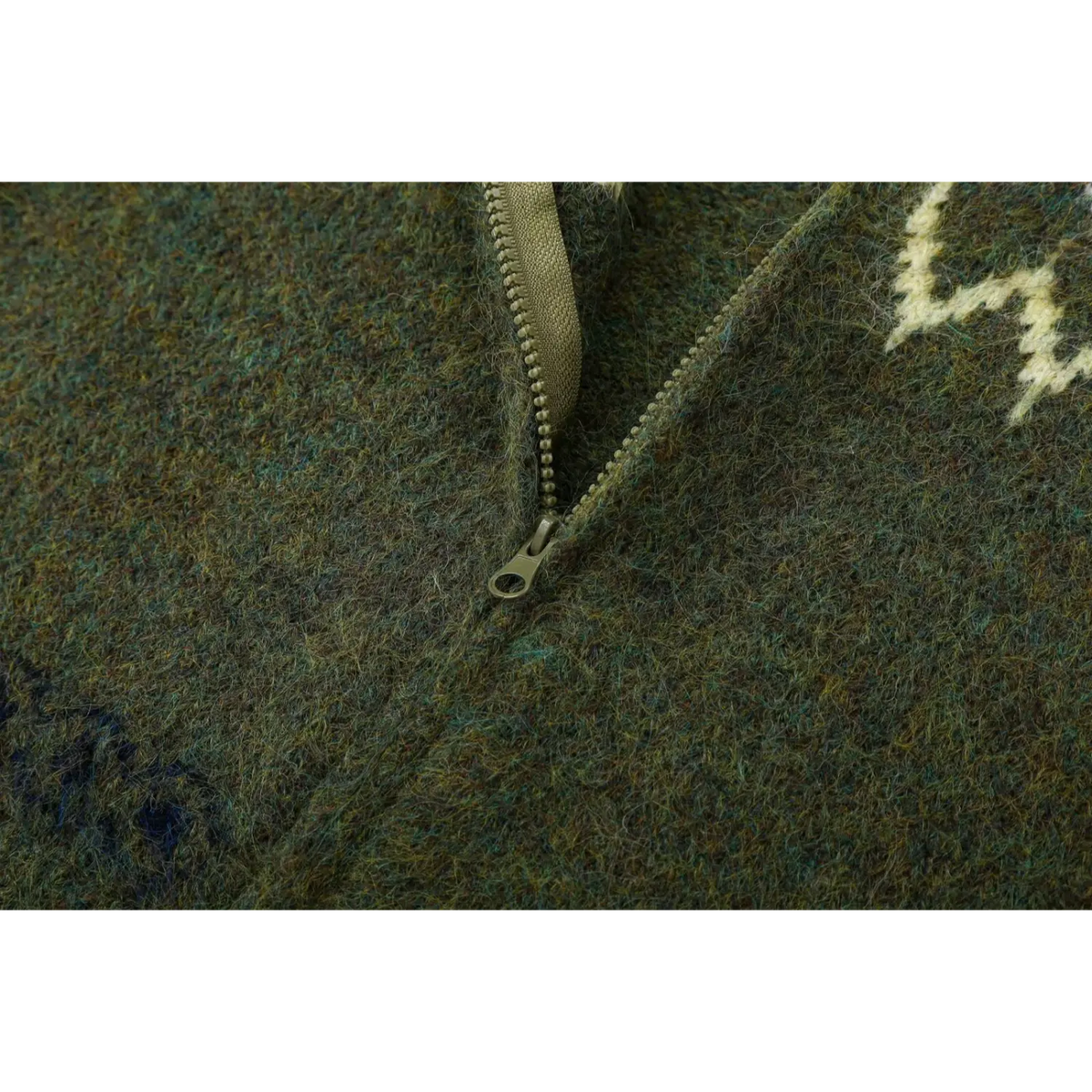 Close-up of plastic zipper teeth and metal pull tab