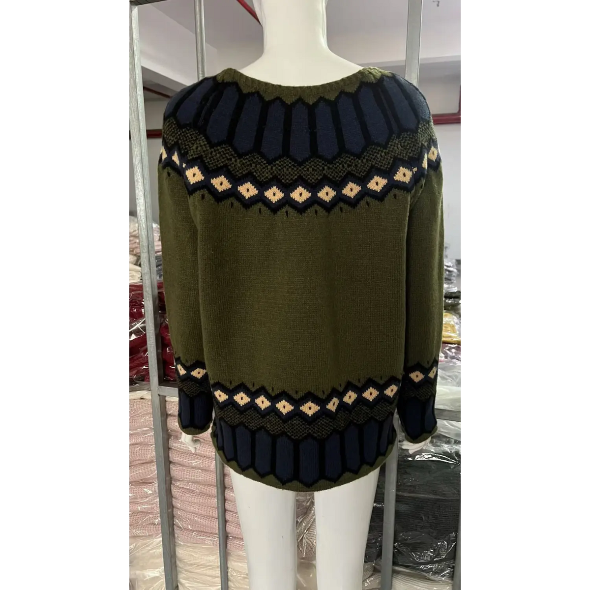 Back view of fair isle yoke hem striped knit sweater on mannequin