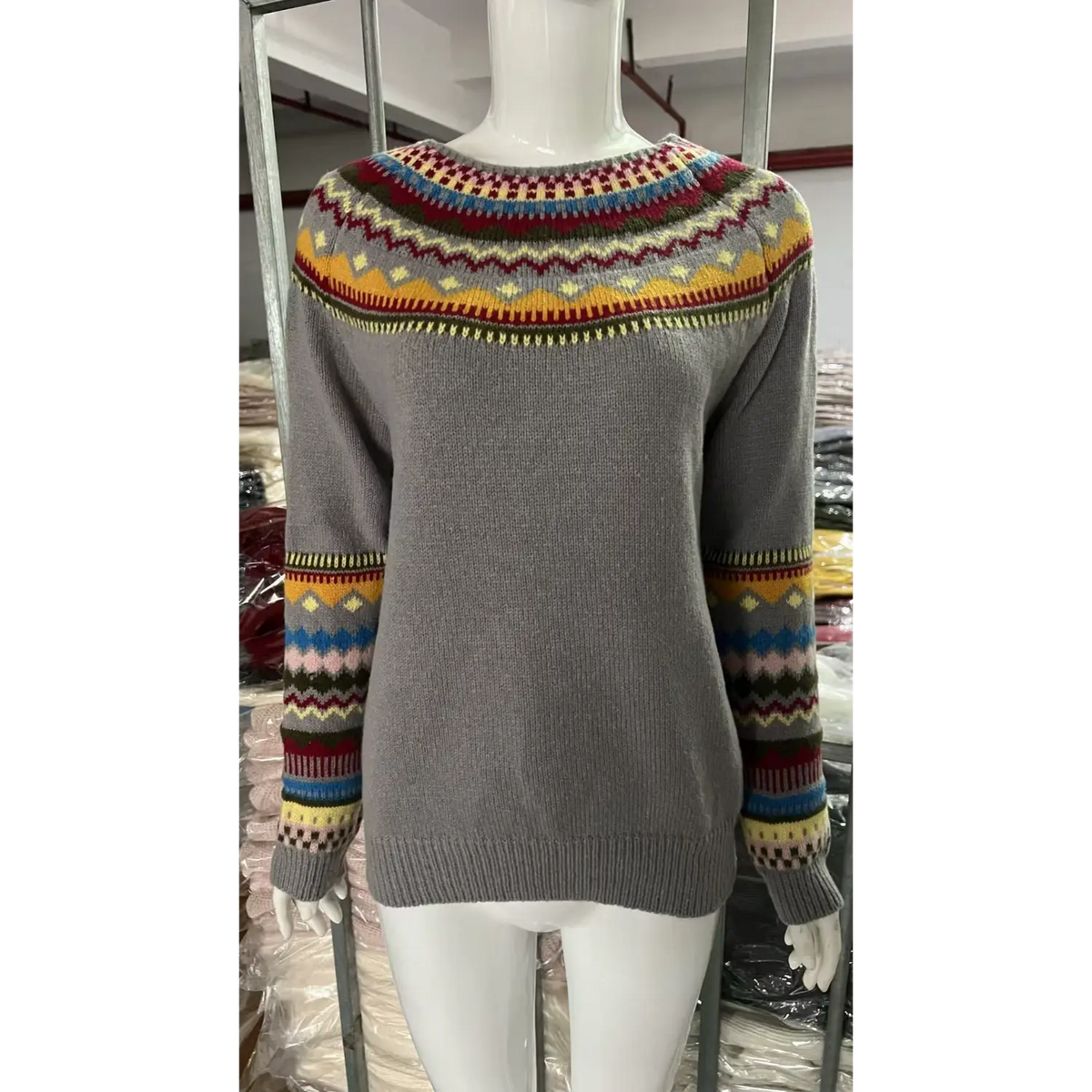 Front view of fair isle yoke striped knit sweater on mannequin