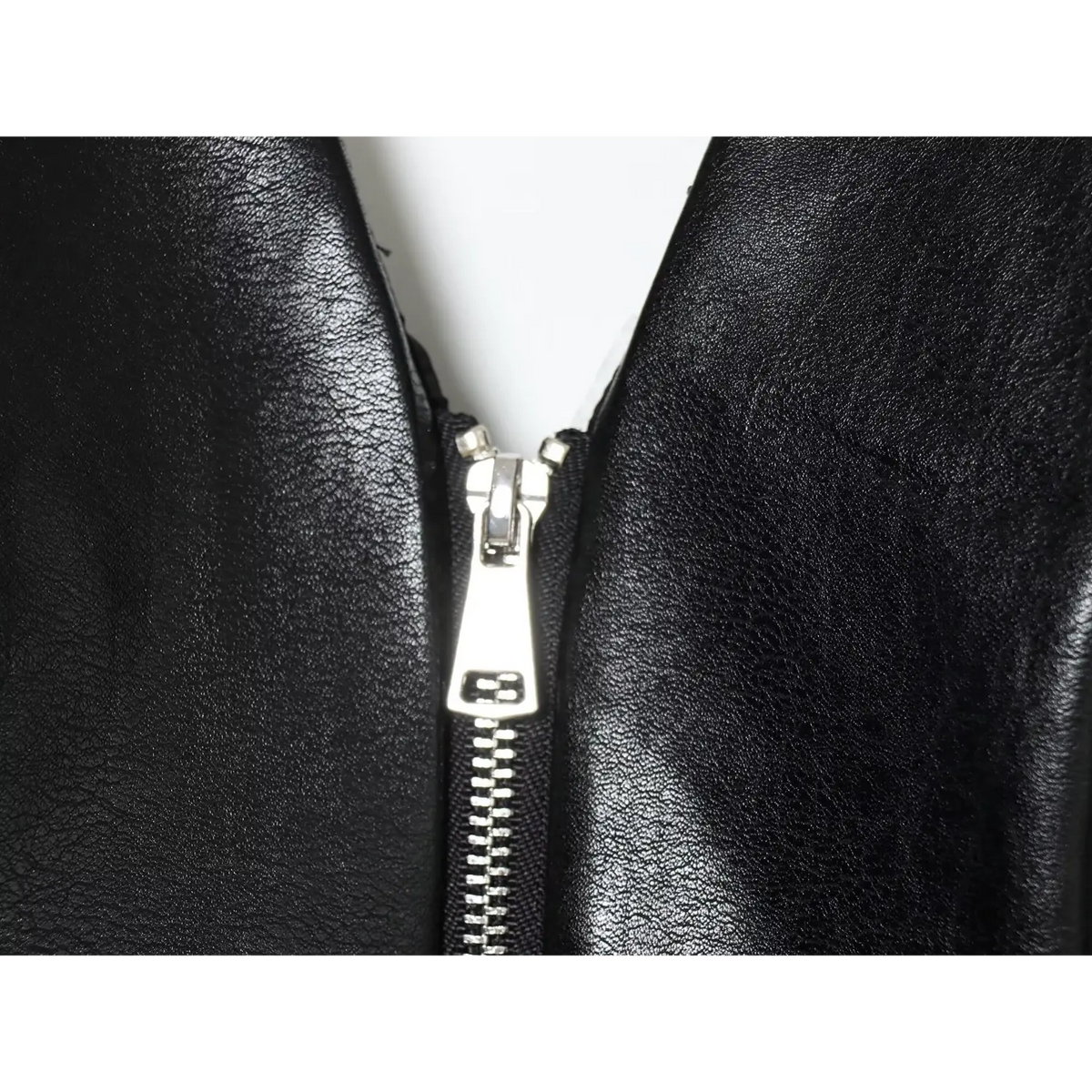 Close-up of black silver zipper pull