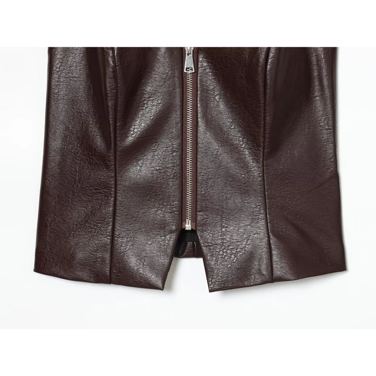 Close-up of brown hem zipper slit