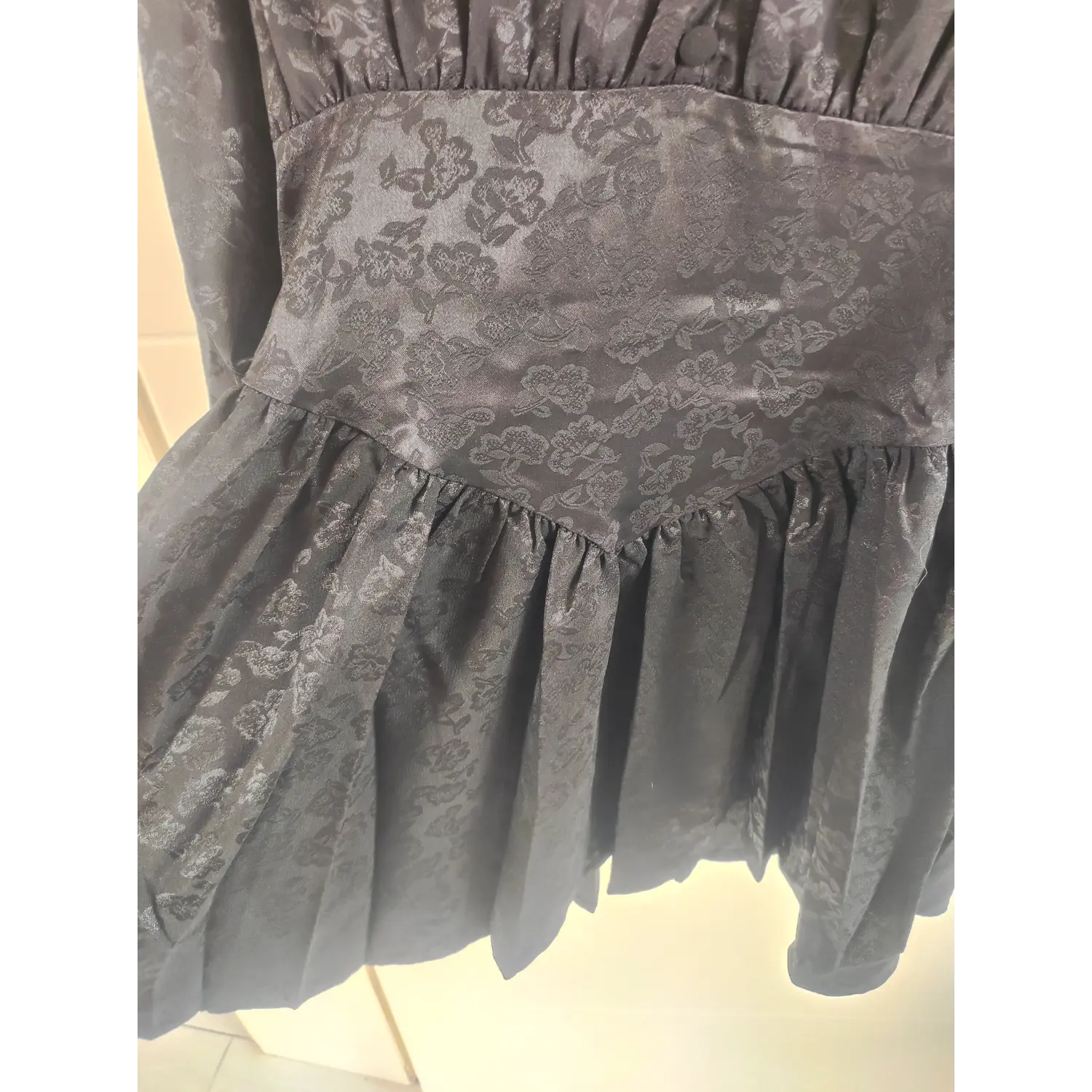 Triangle waist panel and gathered ruffle skirt hem, black jacquard short dress | Detail