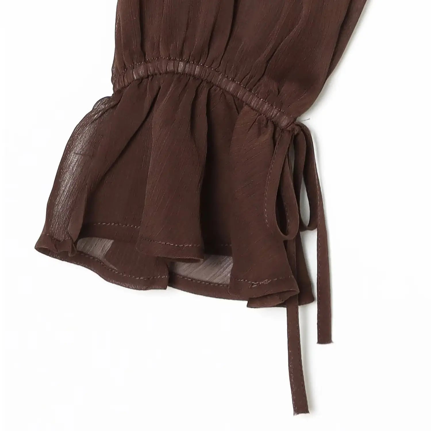 Puff flare ruffle cuff tie macro close-up, cuff elastic gathering adjustable thin tie double ruffle sleeve hem lightweight sheer chiffon drape stitching craft shot