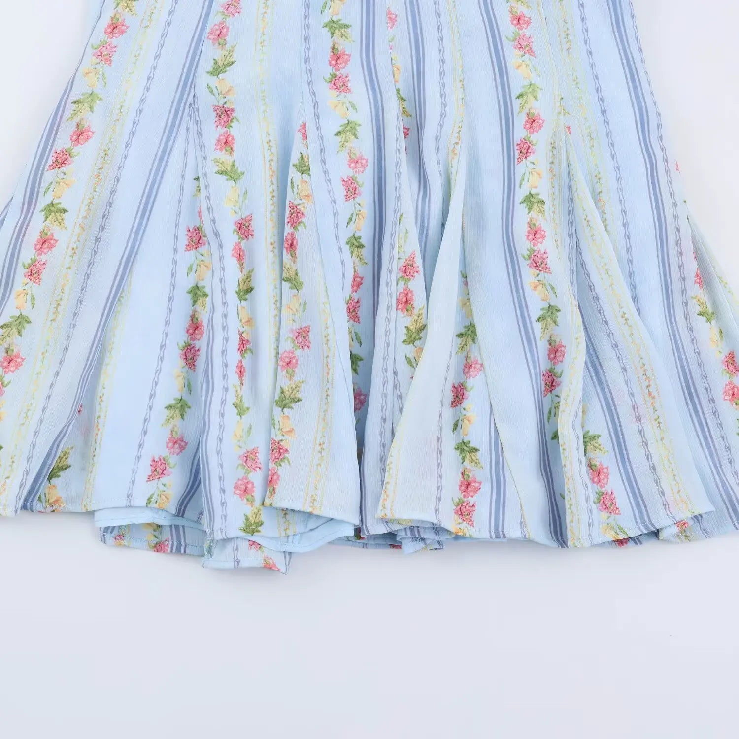 Whole skirt hem flat overview shot, double tier cascading ruffle layers, lightweight crinkled woven allover floral stripe print