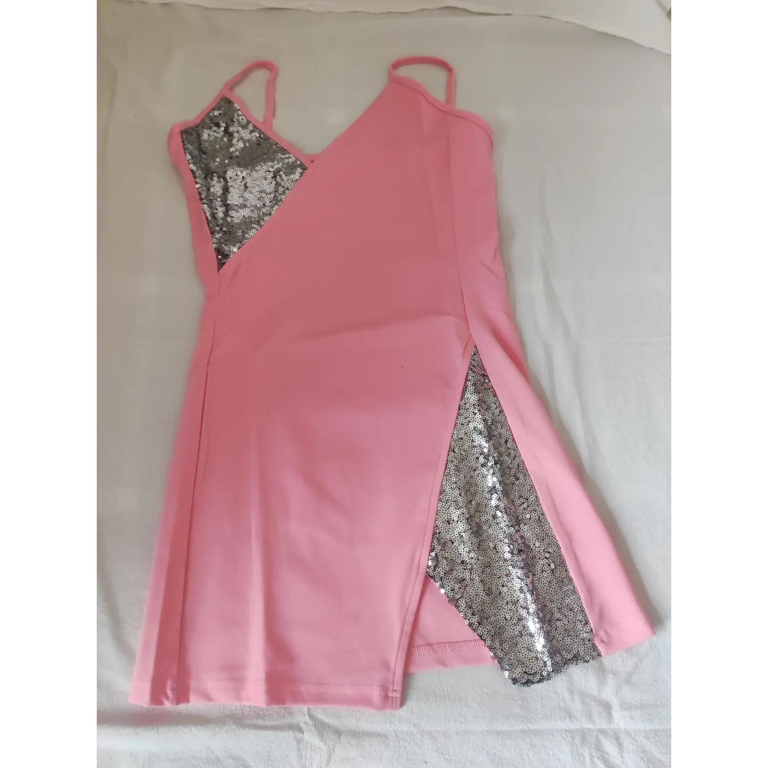  Flat lay view pink sleeveless spaghetti strap mini dress featuring silver sequin patchwork on chest and side slit