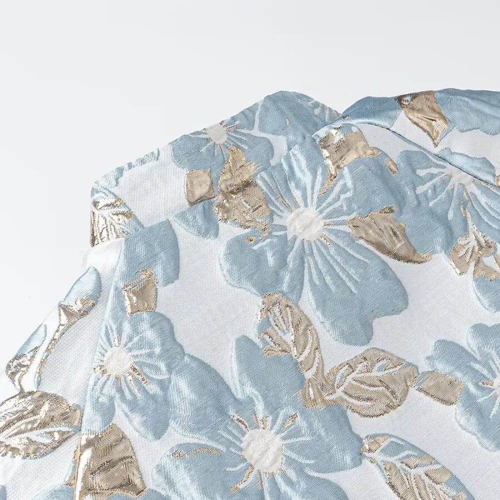Close-up of stand collar and metallic gold floral brocade