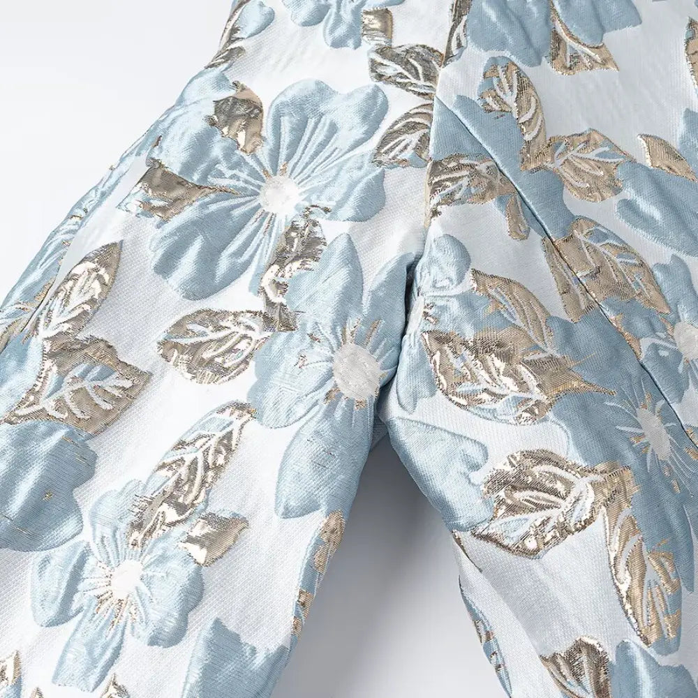 Close-up of metallic gold floral brocade texture