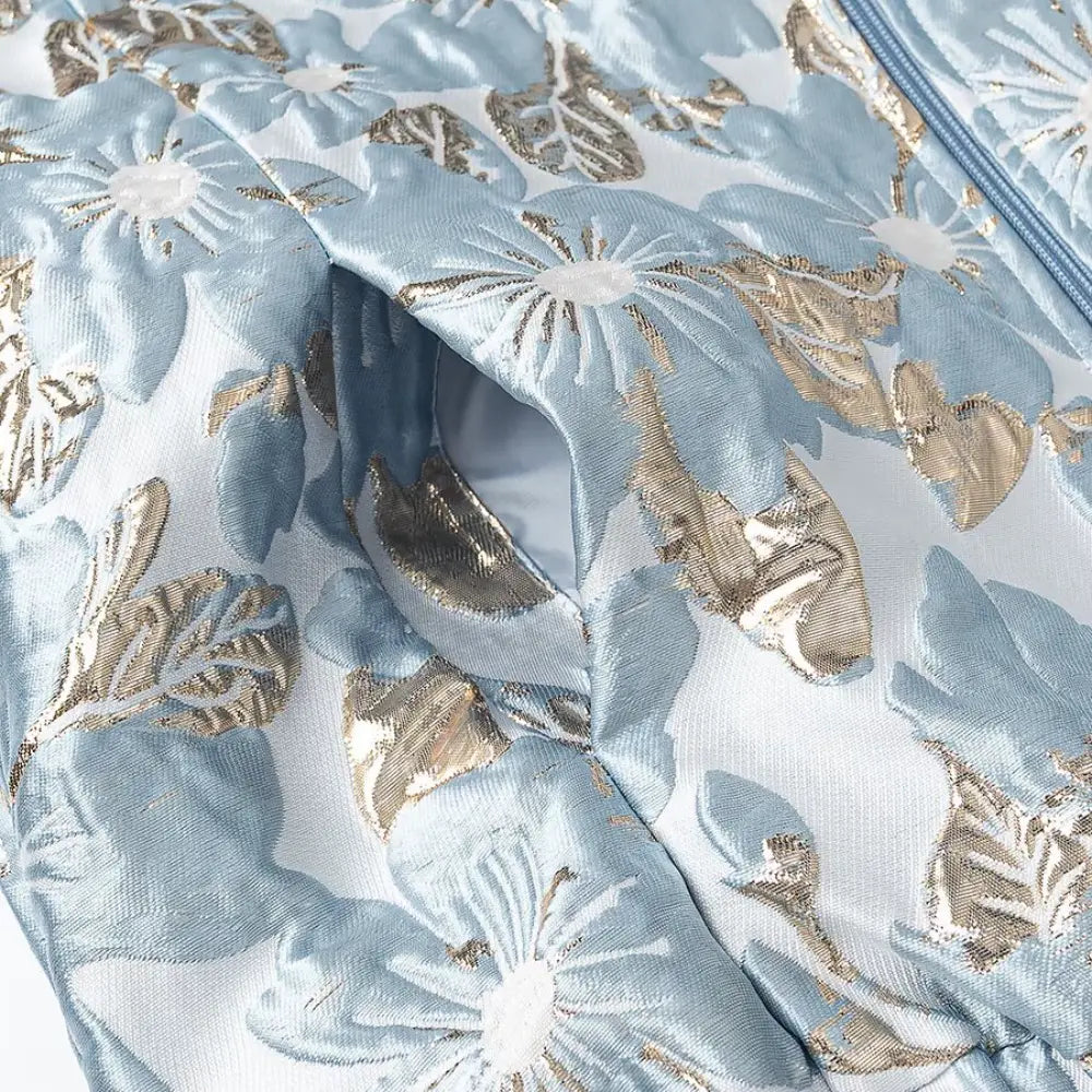 Close-up of side pocket opening and floral brocade