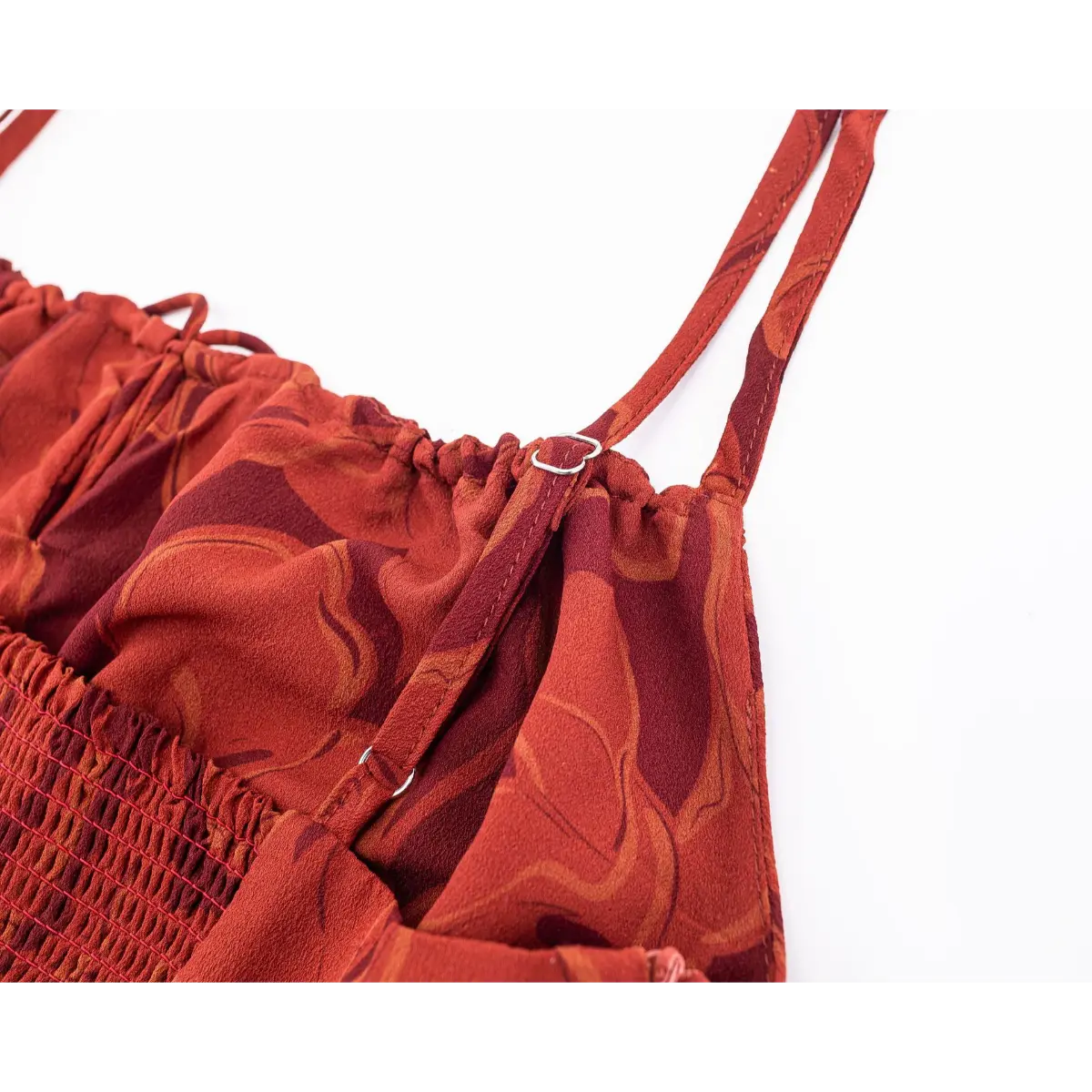 Close-up of adjustable metal slider on self-fabric printed spaghetti strap.