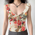 Oil painting rose floral cami real model front wearing shot, V-neck drawstring shape bust ruffle cap sleeves hide arm cropped fit lengthen proportion match black pants feminine daily outfit display