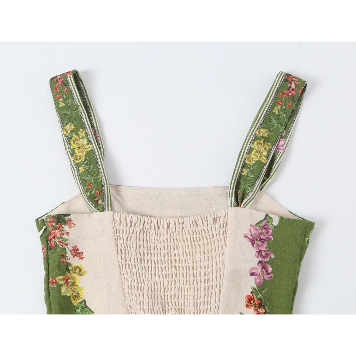 Close-up of smocked back and straps