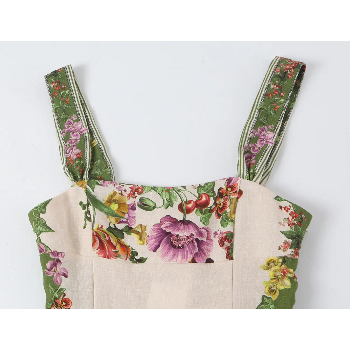 Close-up of square neckline wide straps and print