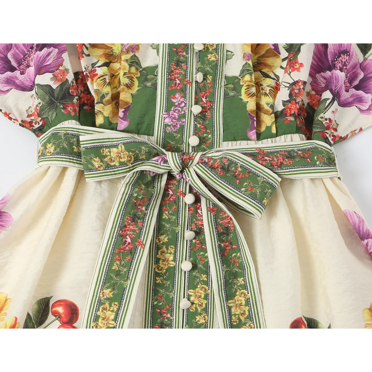 Close-up of self-tie belt and button front