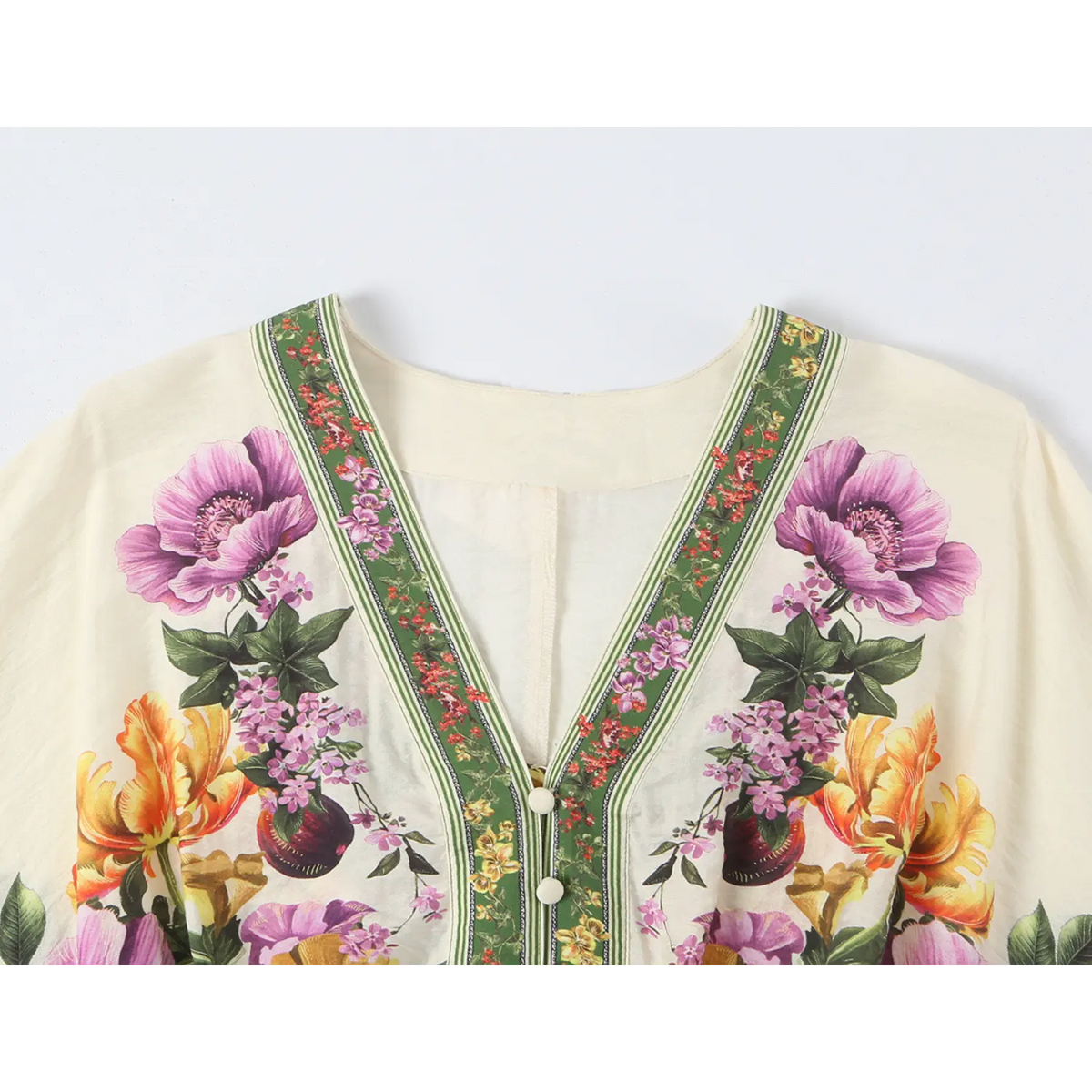 Close-up of V neckline button front and green trim