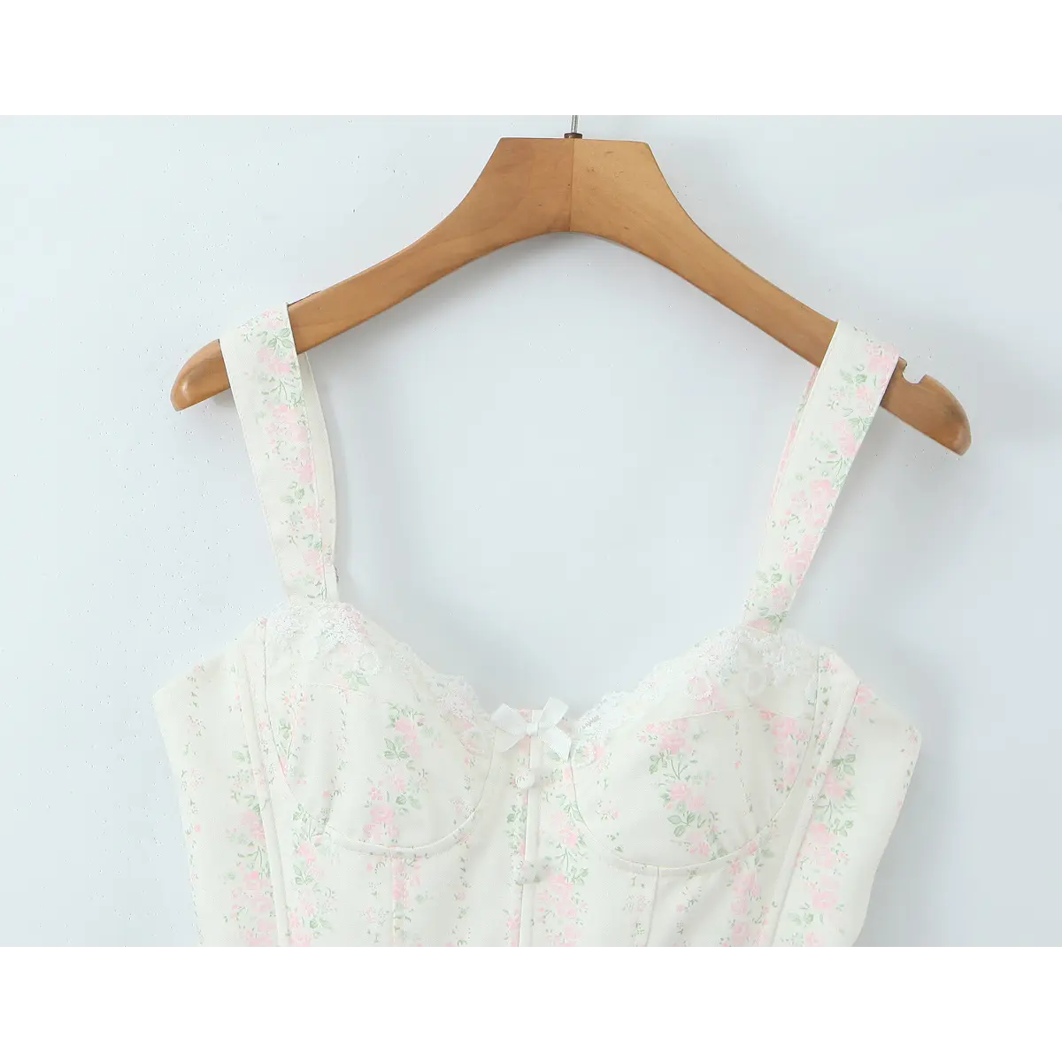 Full front view of the white floral bustier, showing lace trim, sweetheart neckline, and adjustable straps.
