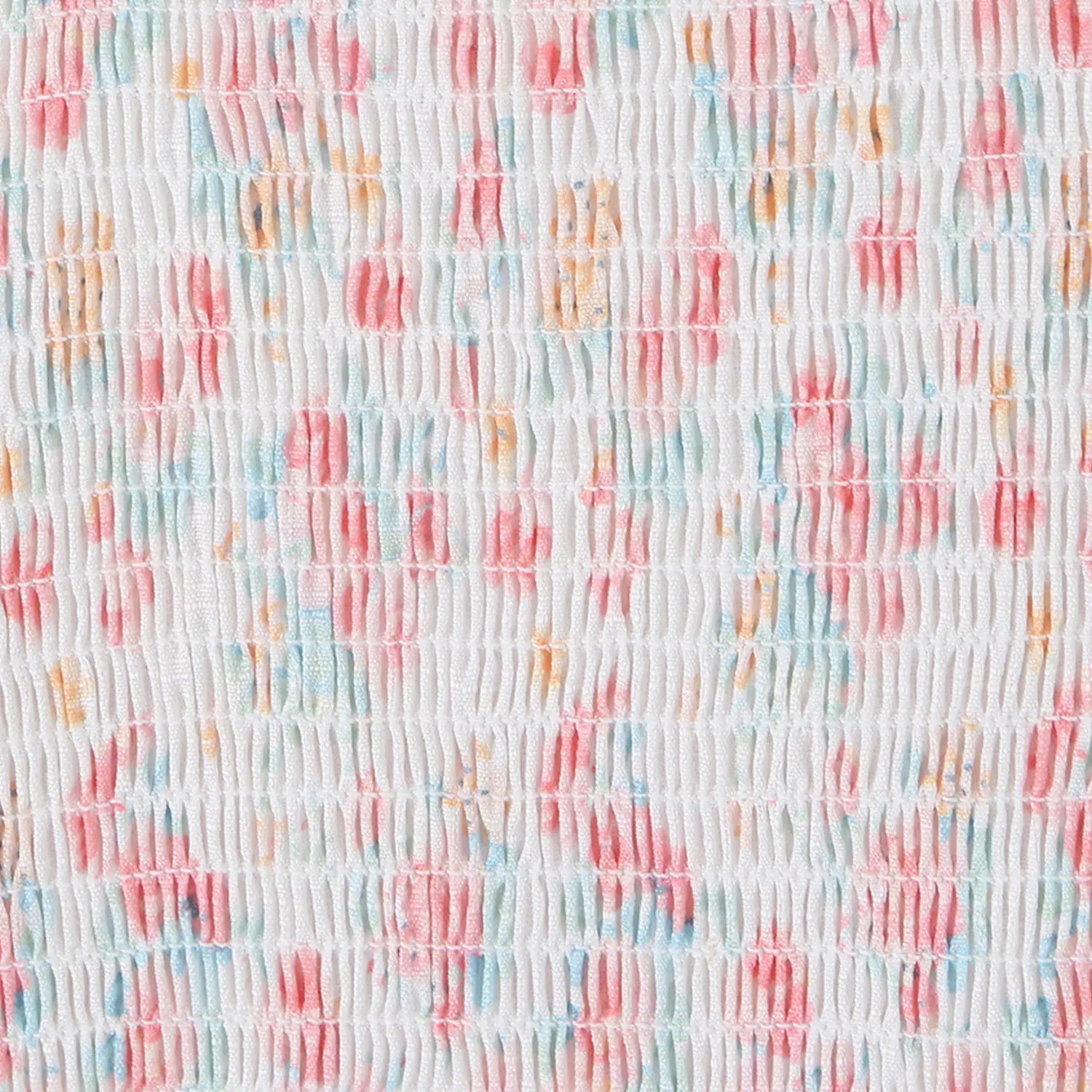 Pastel floral crop top back smocked fabric close-up, elastic ruched texture all over print flat lay detail