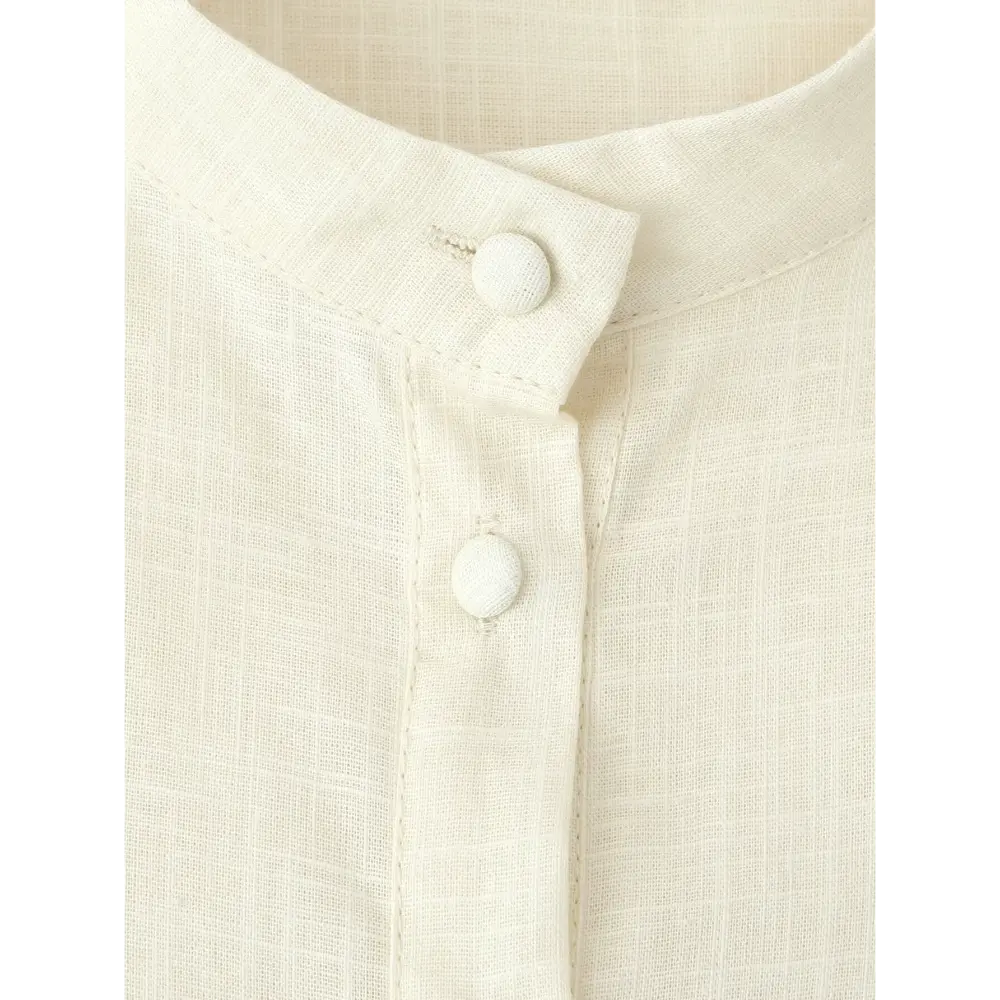 Close-up of covered fabric button at stand collar