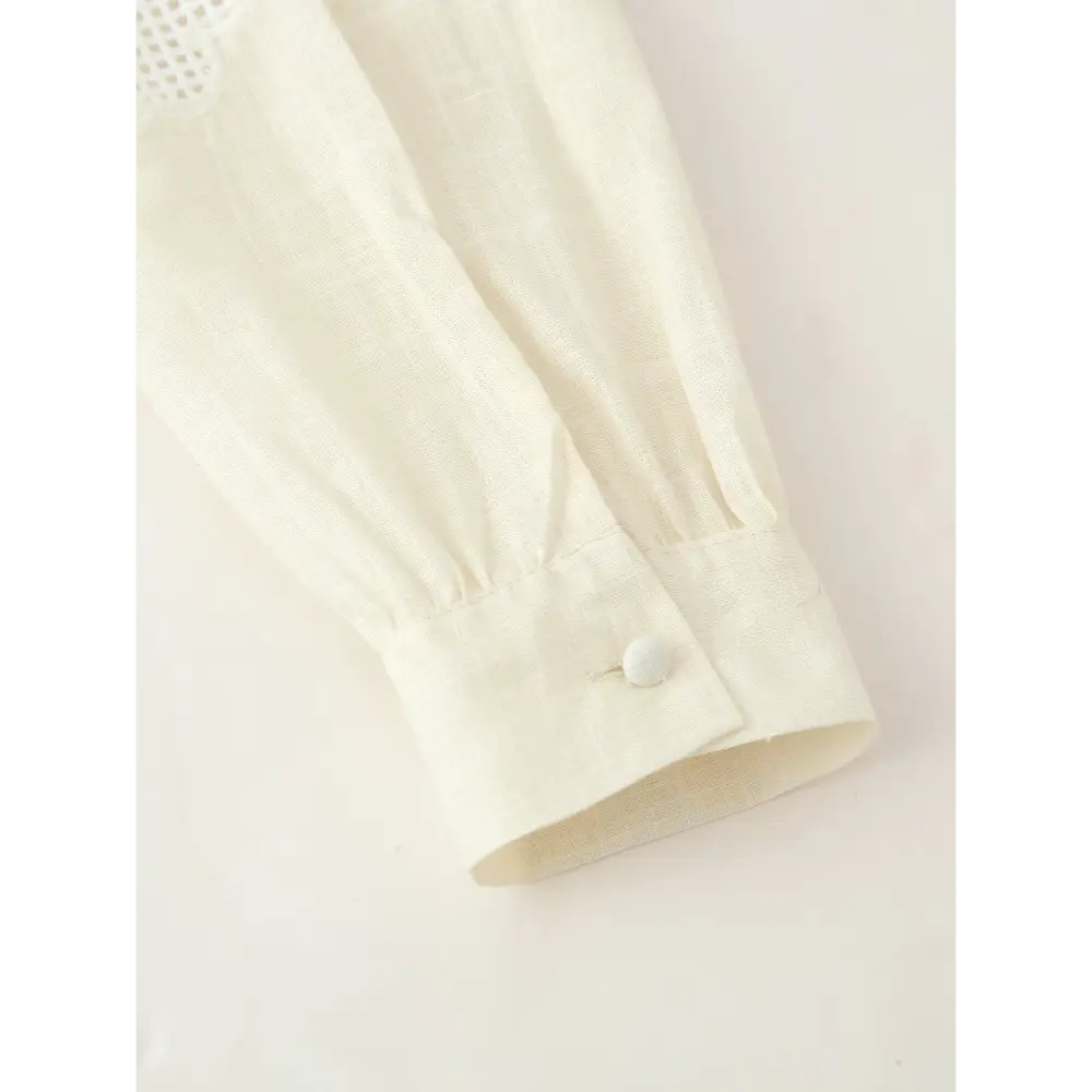 Close-up of buttoned long sleeve cuff
