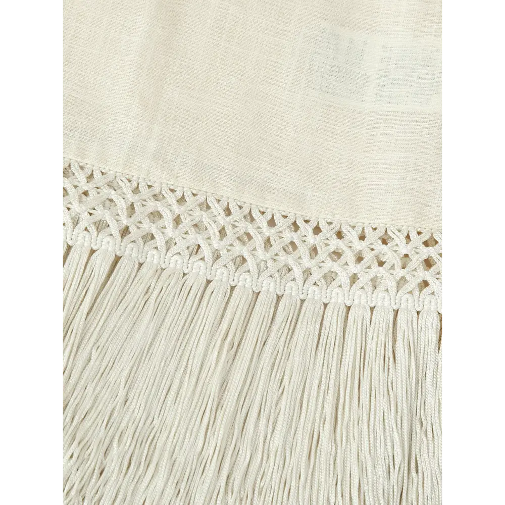 Close-up of macrame lace trim and fringe hem