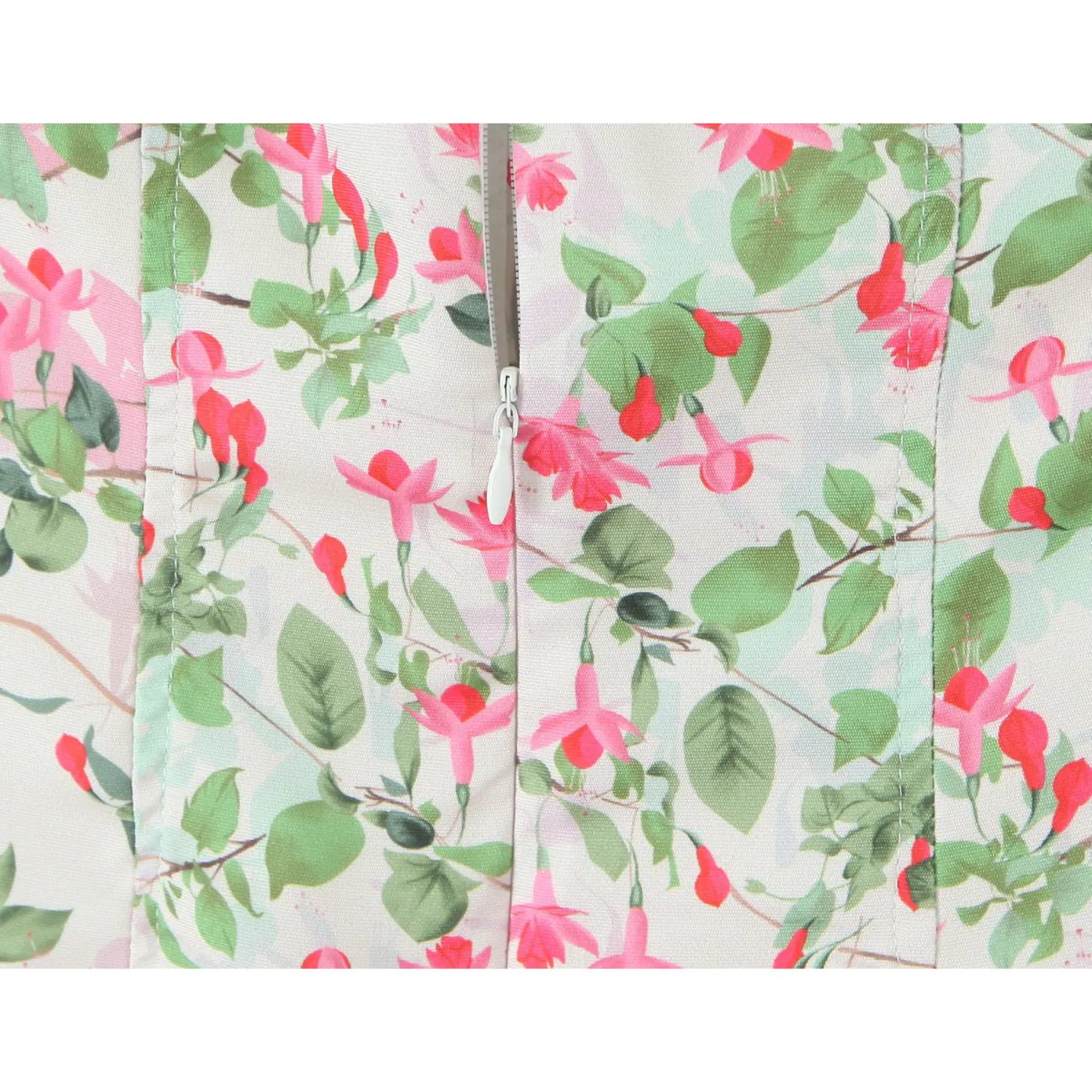 Macro shot matching print invisible zipper, teardrop fabric pull tab, vertical waist shaping seams intersect waist gather line