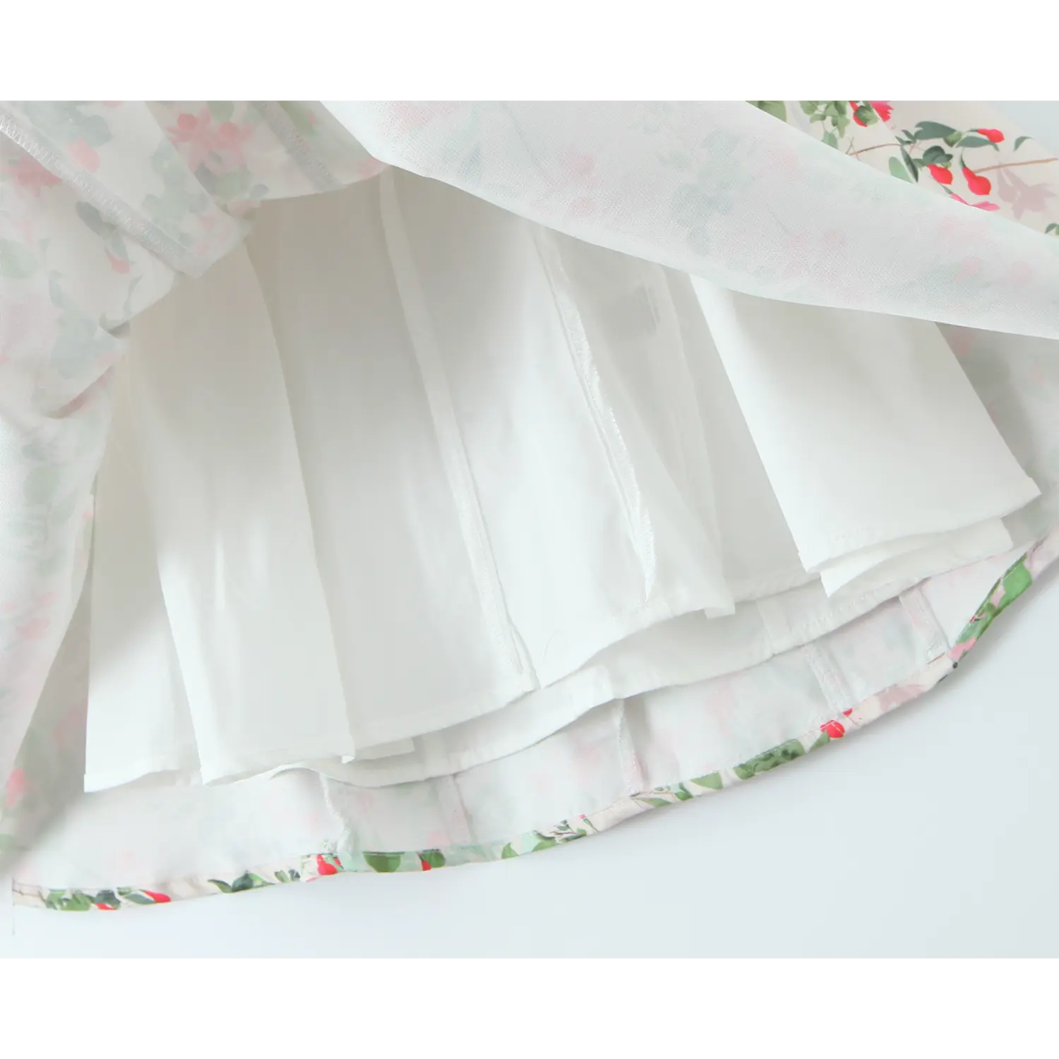 Skirt hem flipped open, full white smooth lining plus inner tulle layer for extra flare volume, neat hem binding stitch