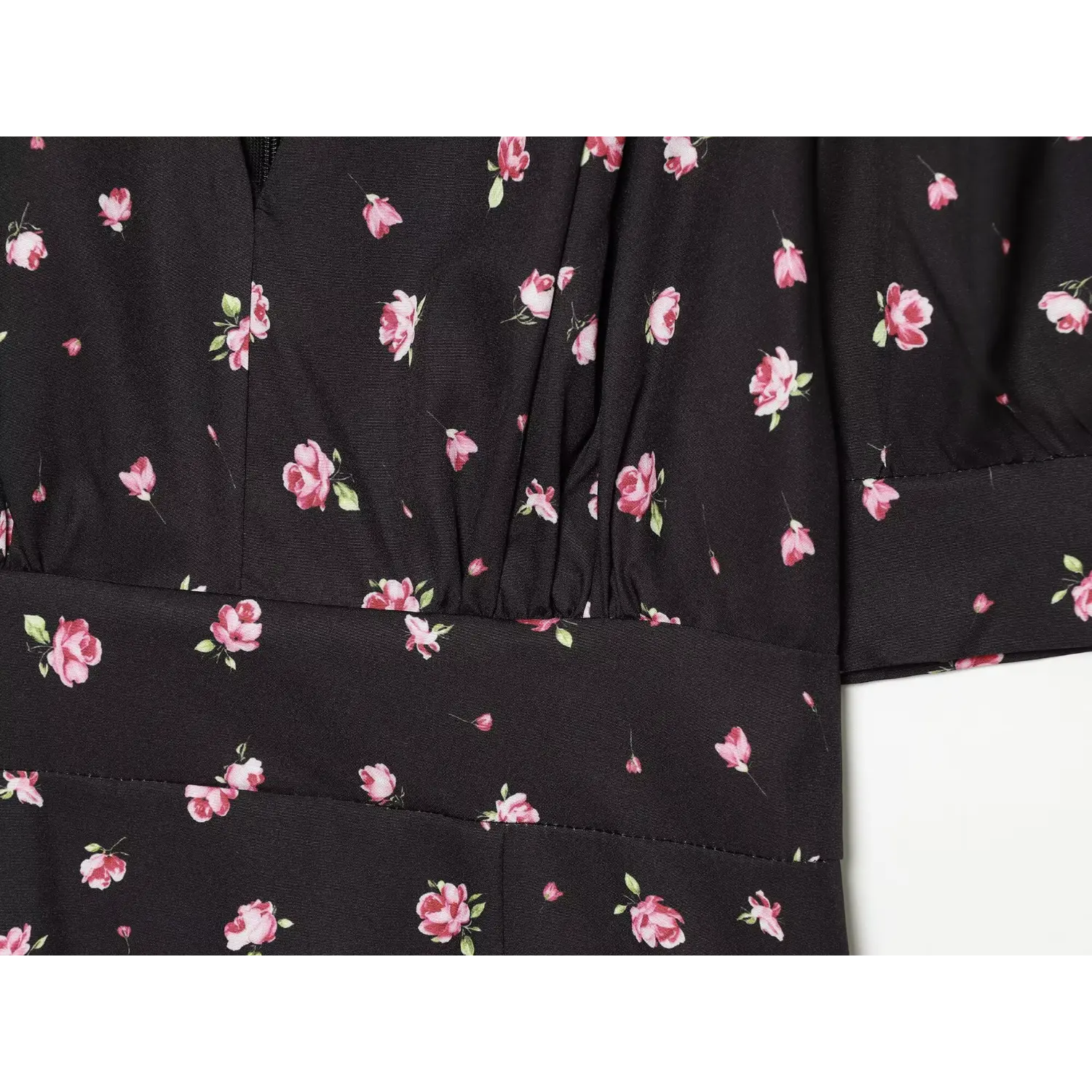 Close-up waist and front pleated bodice stitching of black pink ditsy floral dress