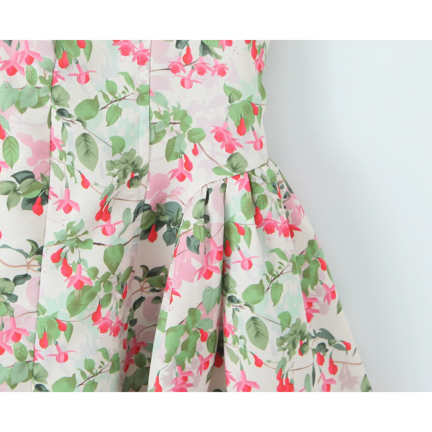 Waist hip partial shot, vertical shaping corset seams, horizontal gather waistline, continuous floral print across panels