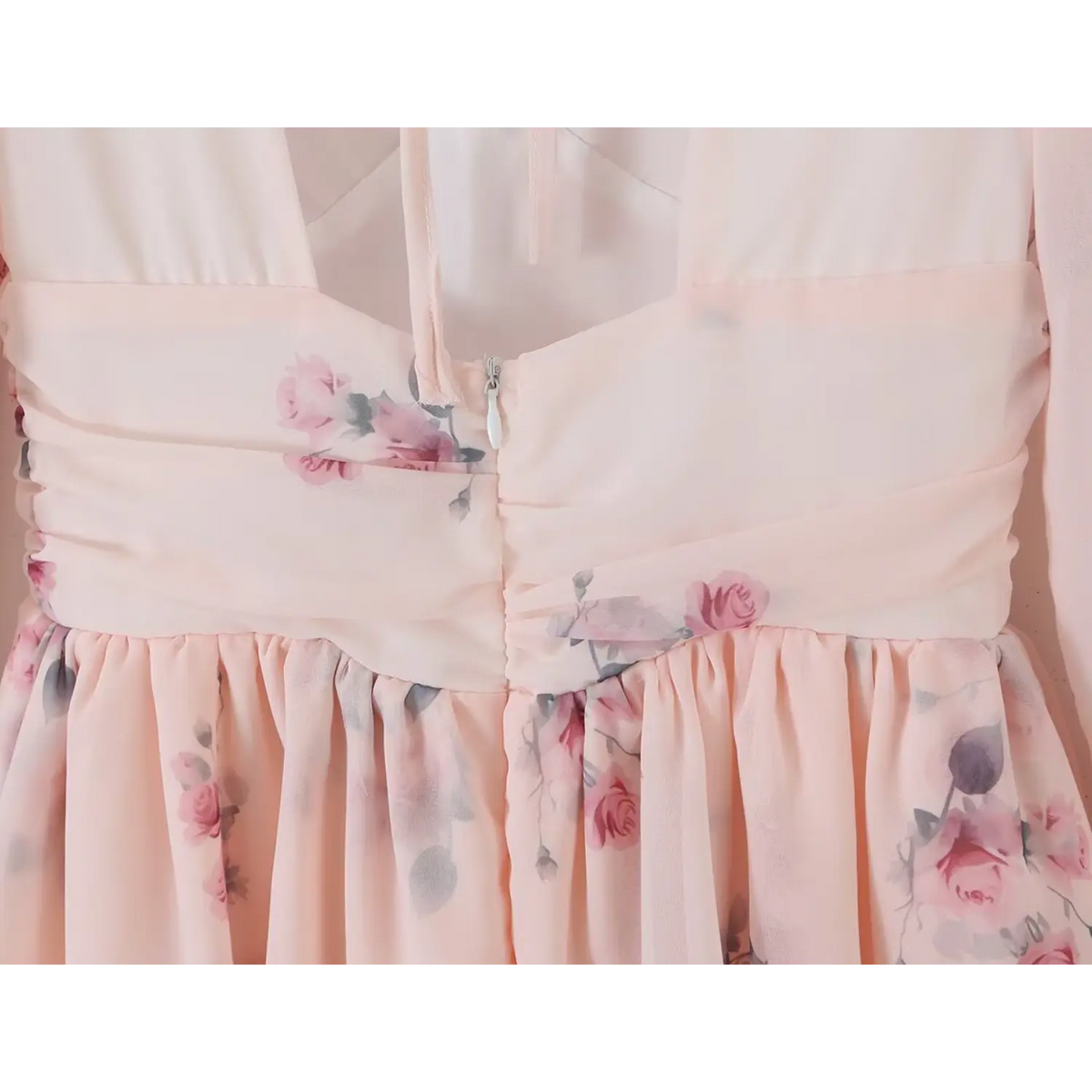 Close up of side back invisible zipper, ruched waist panel with pink rose floral chiffon
