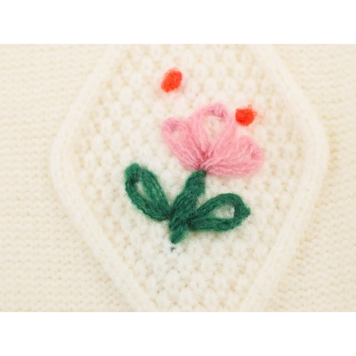 Close-up of pink tulip embroidery detail