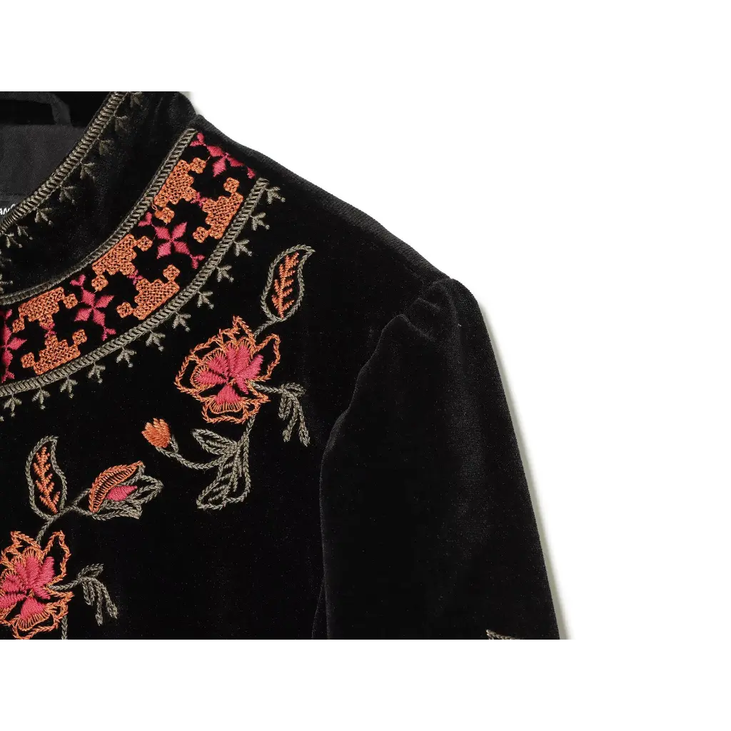 Close-up of shoulder floral embroidery detail