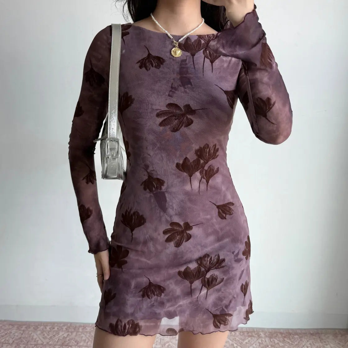 Model wearing floral flocked boat neck long sleeve bodycon mini dress, close-up front view