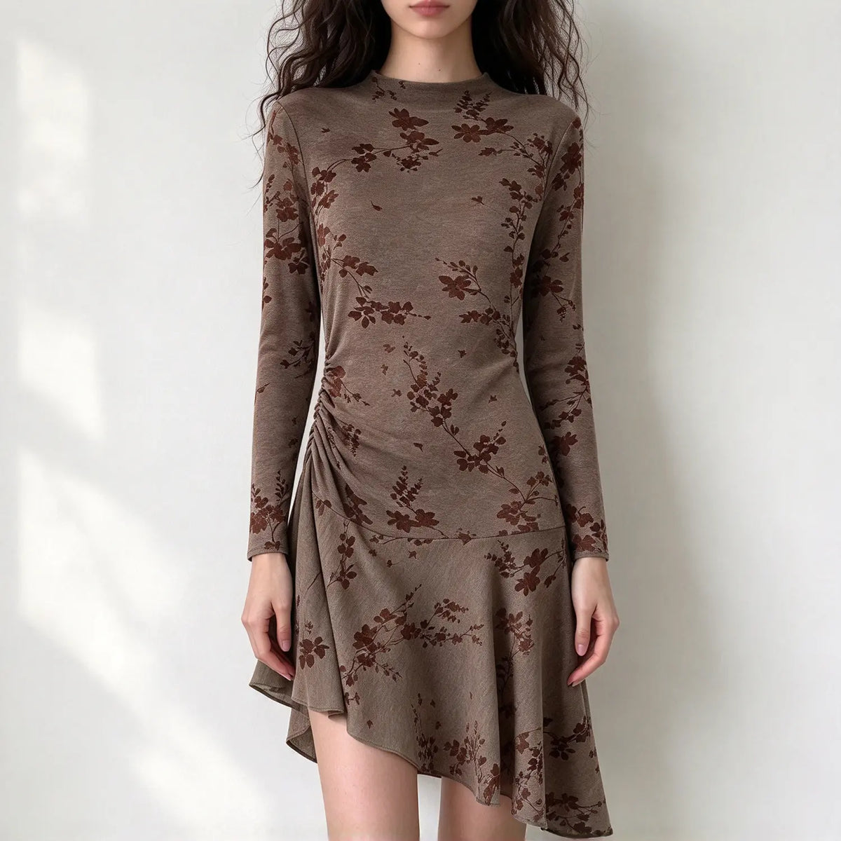 Model wearing mocha floral flocked mock neck asymmetric dress, front view