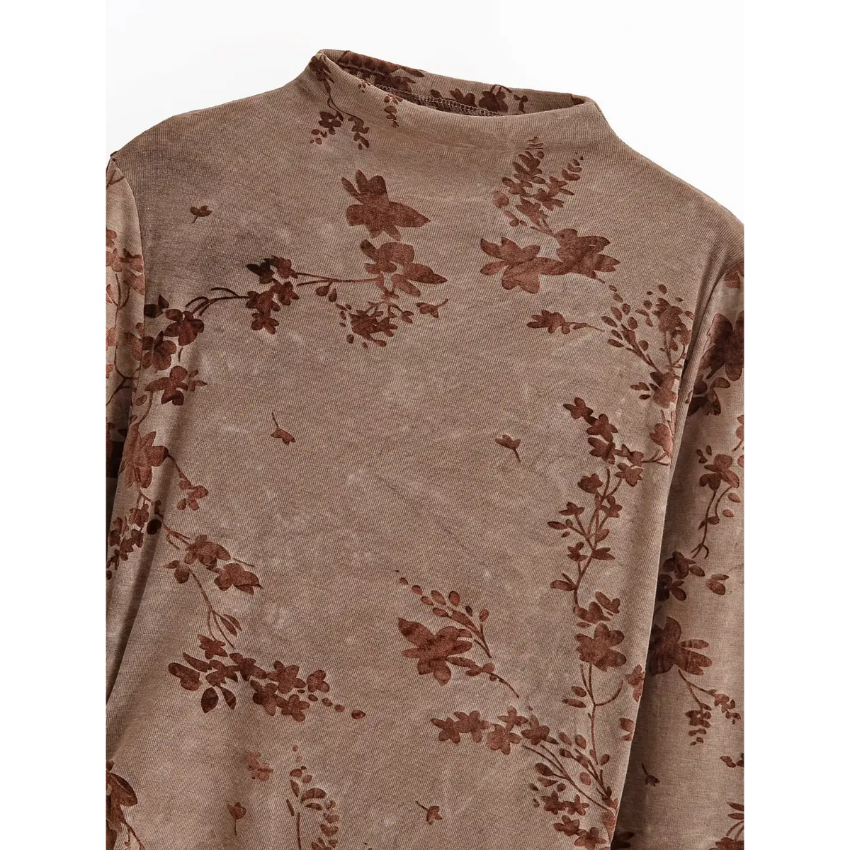 Close-up of mock neck and flocked floral print