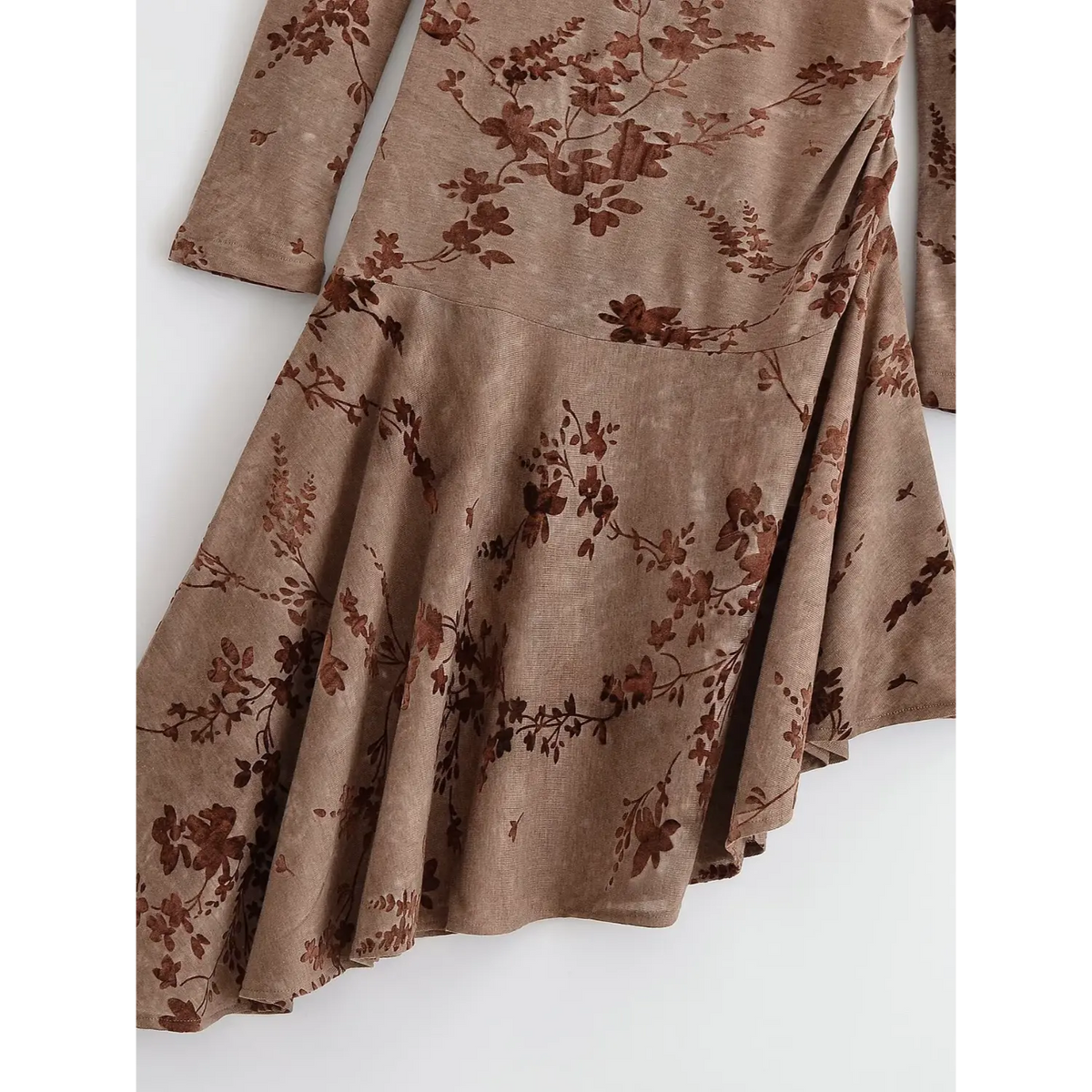 Close-up of ruffle hem and flocked floral print