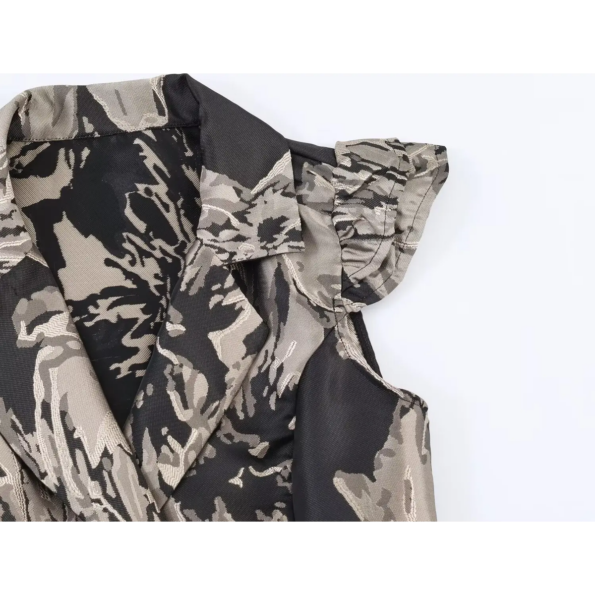 Macro detail of ruffle cap sleeve and blazer collar for black grey floral jacquard mini dress, textured woven fabric