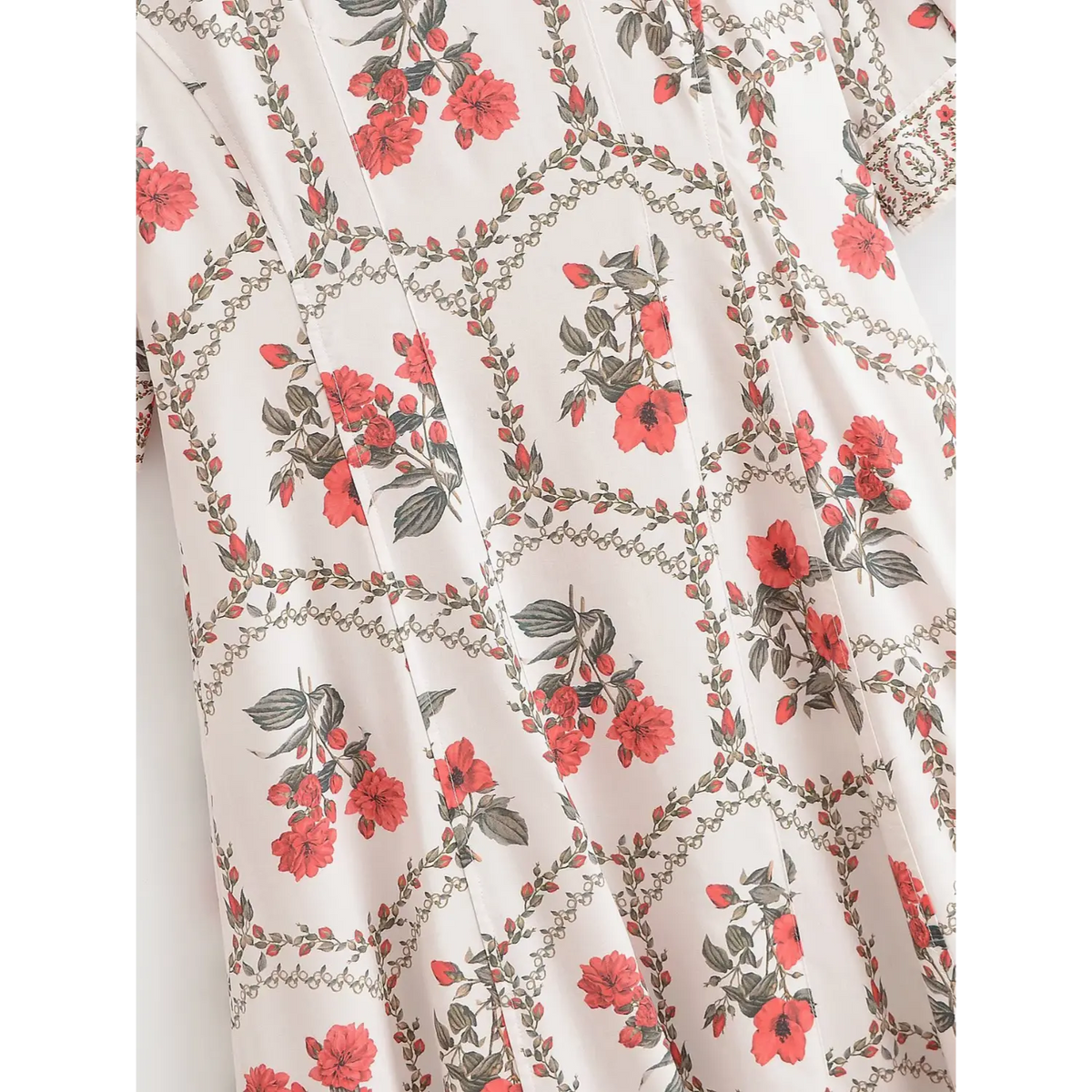 Back skirt closeup of floral maxi dress, red botanical floral pattern and vertical seam details on lightweight fabric