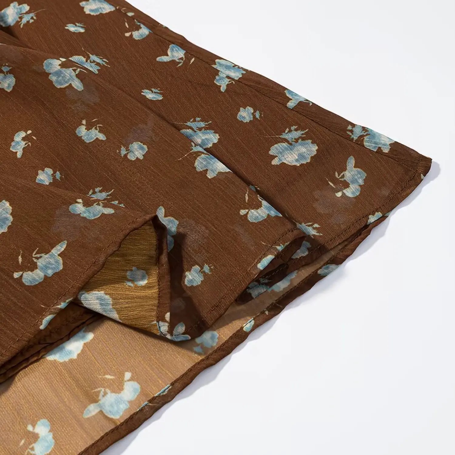 Midi skirt hem partial shot, sheer floral outer chiffon + solid coffee inner lining, neat serged hem stitching