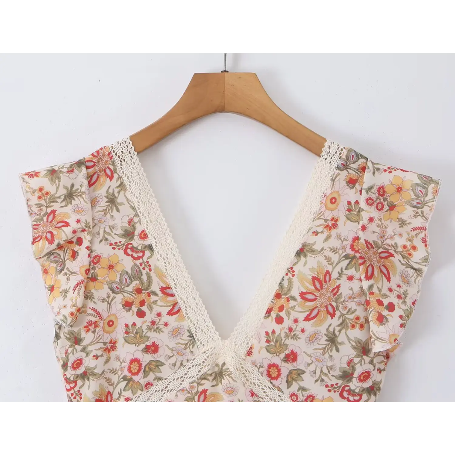 Close up hanging detail white hollow lace trim deep V neck, flutter ruffle cap sleeve, cream retro floral print woven dress