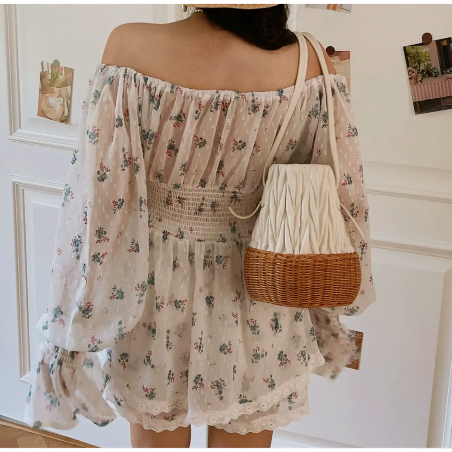 Full back lifestyle shot floral two piece set, all-over horizontal elastic smocked back panel, off shoulder ruffle neck, long flared sleeves, matching lace trim shorts