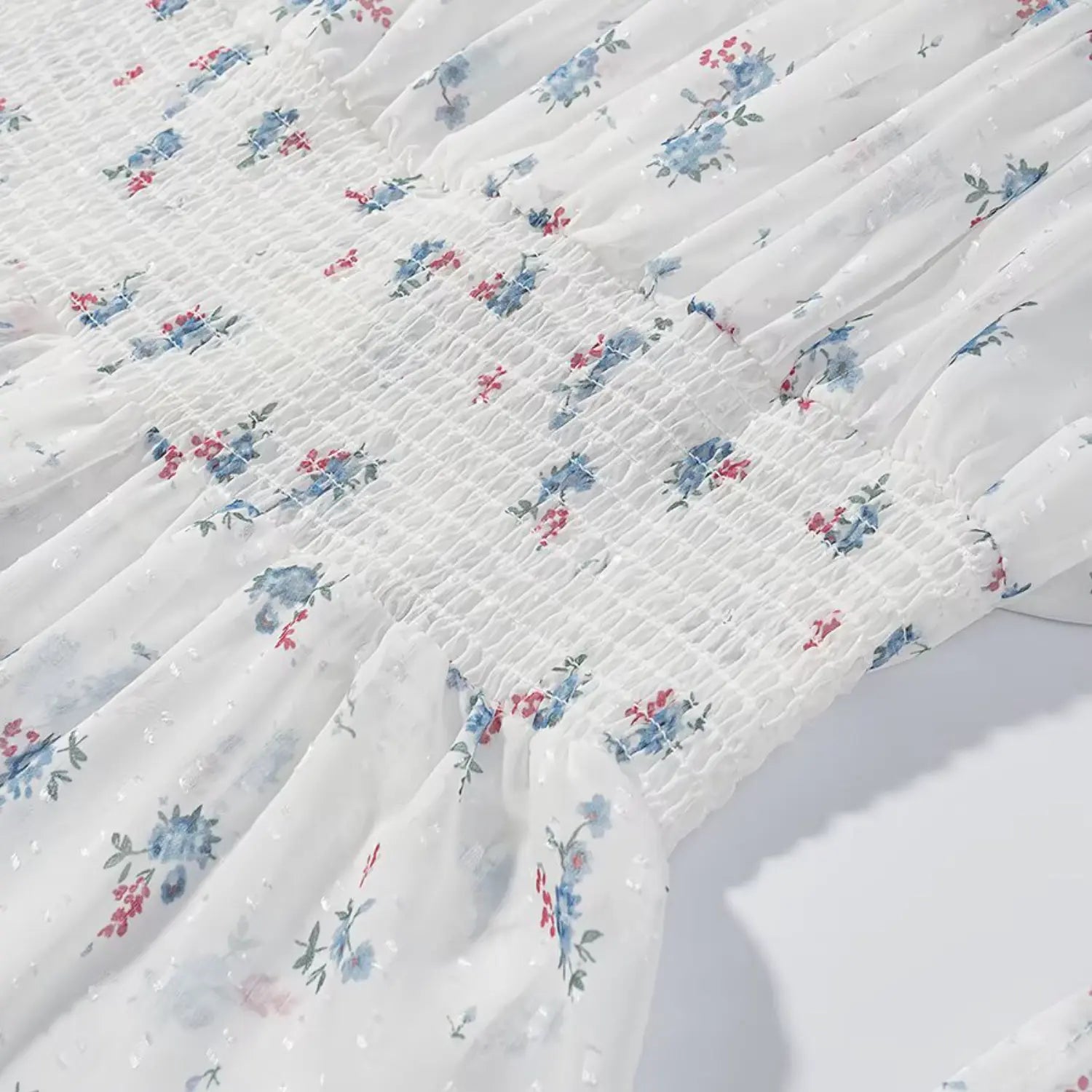 Torso waist section macro texture, dense all-over horizontal stretch shirring, soft crinkle swiss dot cloth, continuous small floral print pattern