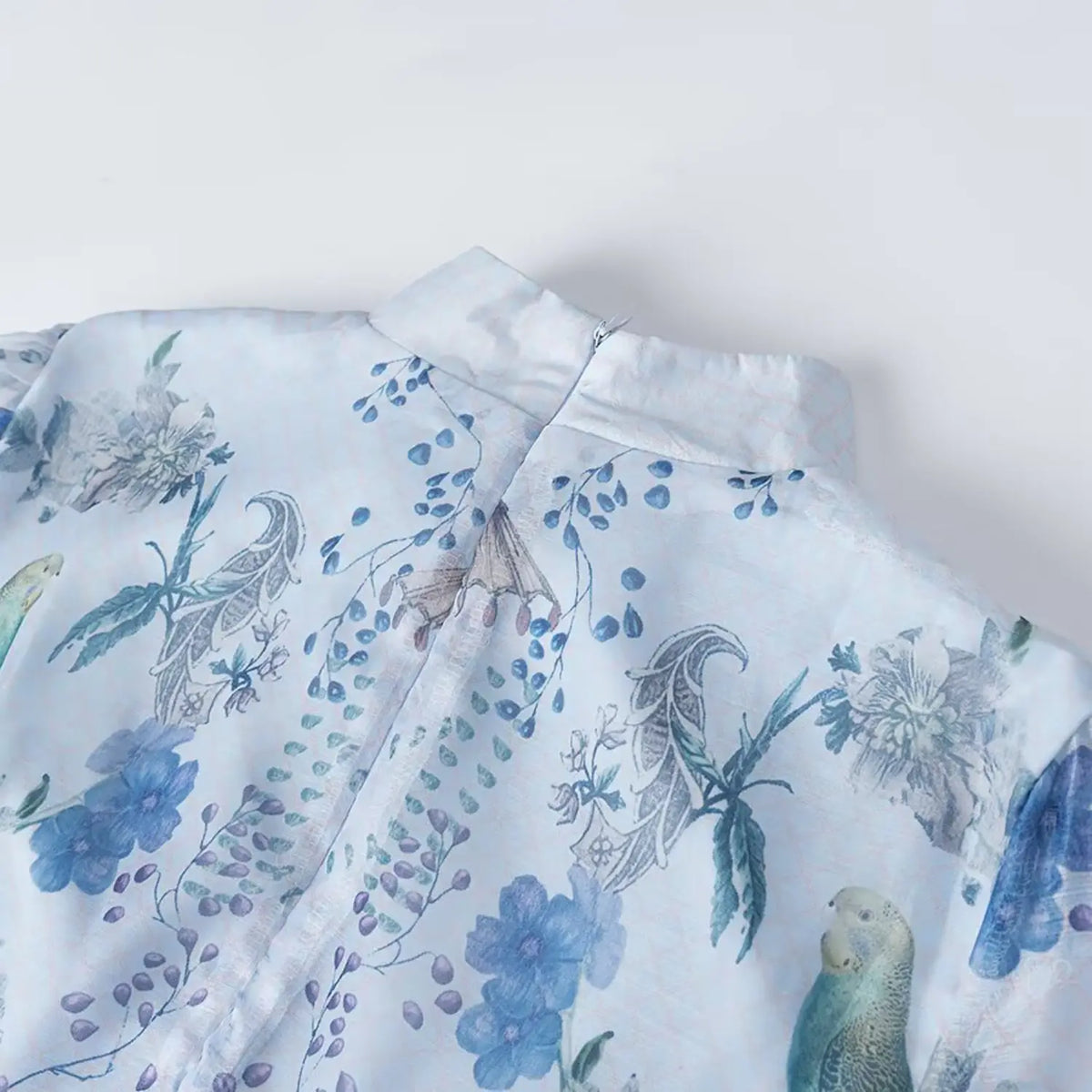 Close-up of back stand collar and invisible zipper on vintage floral parrot chiffon maxi dress