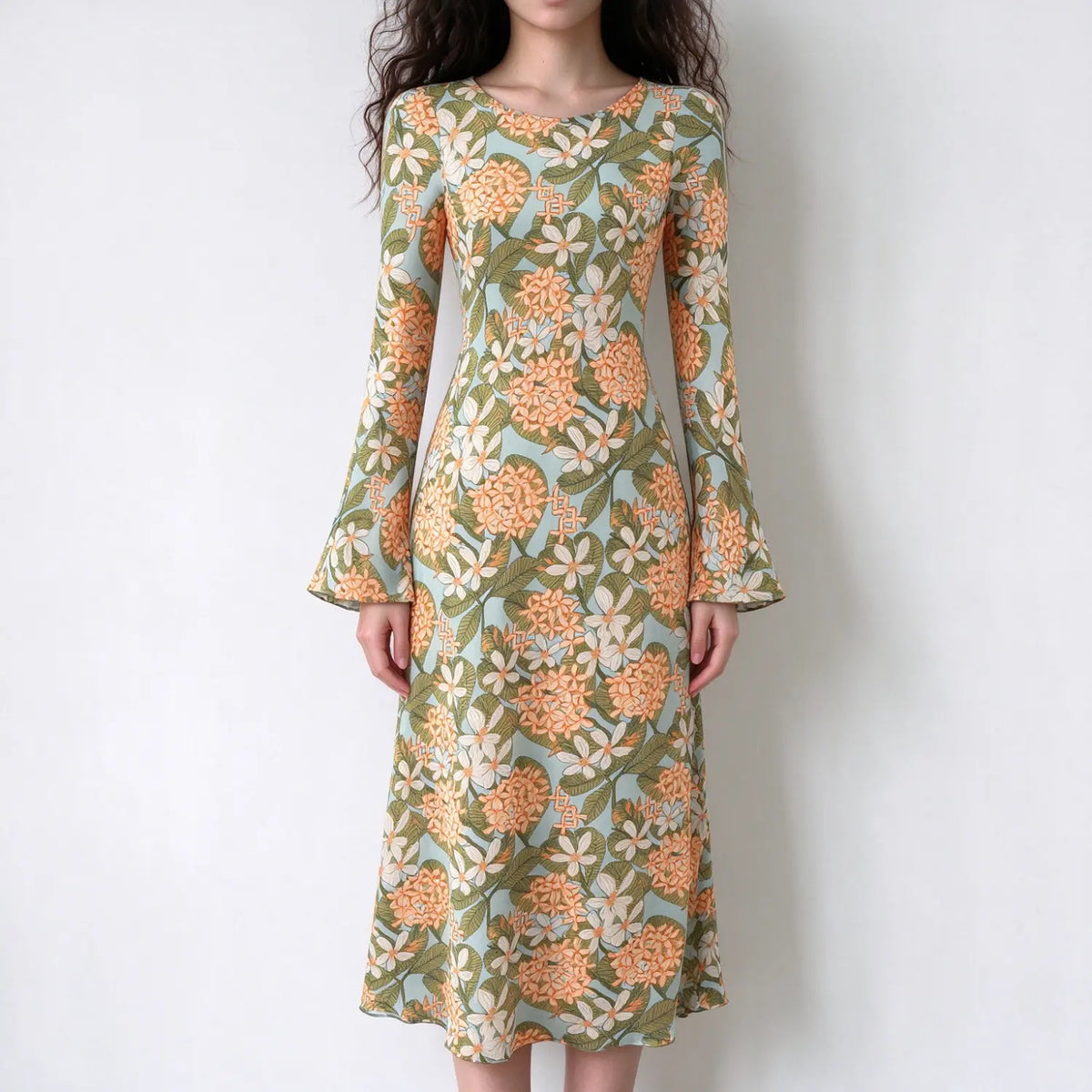 Model wearing floral print bell sleeve fitted midi dress, front view