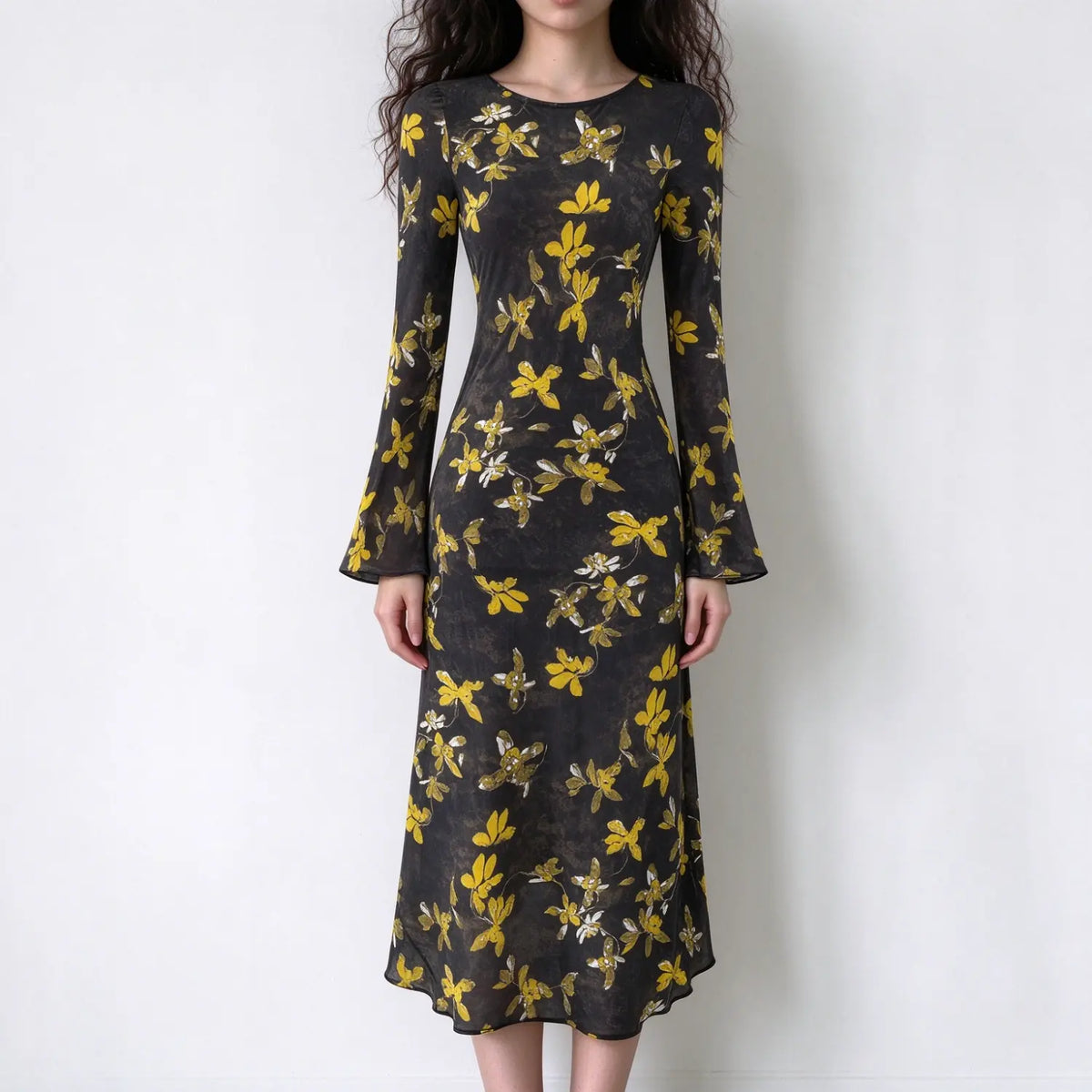 Model wearing floral print bell sleeve midi dress, front view
