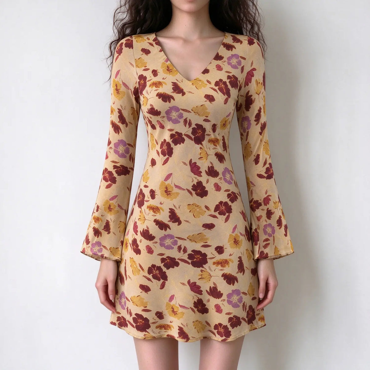 Model wearing floral print bell sleeve mini dress, front view