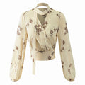 Front flat lay of floral print choker tie wrap blouse