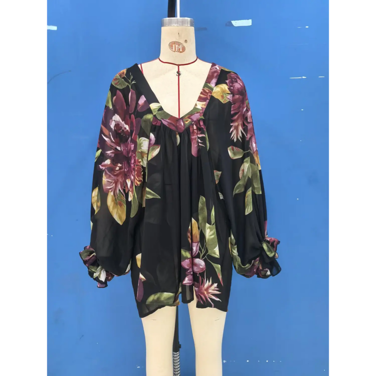 Mannequin front view of floral print blouse