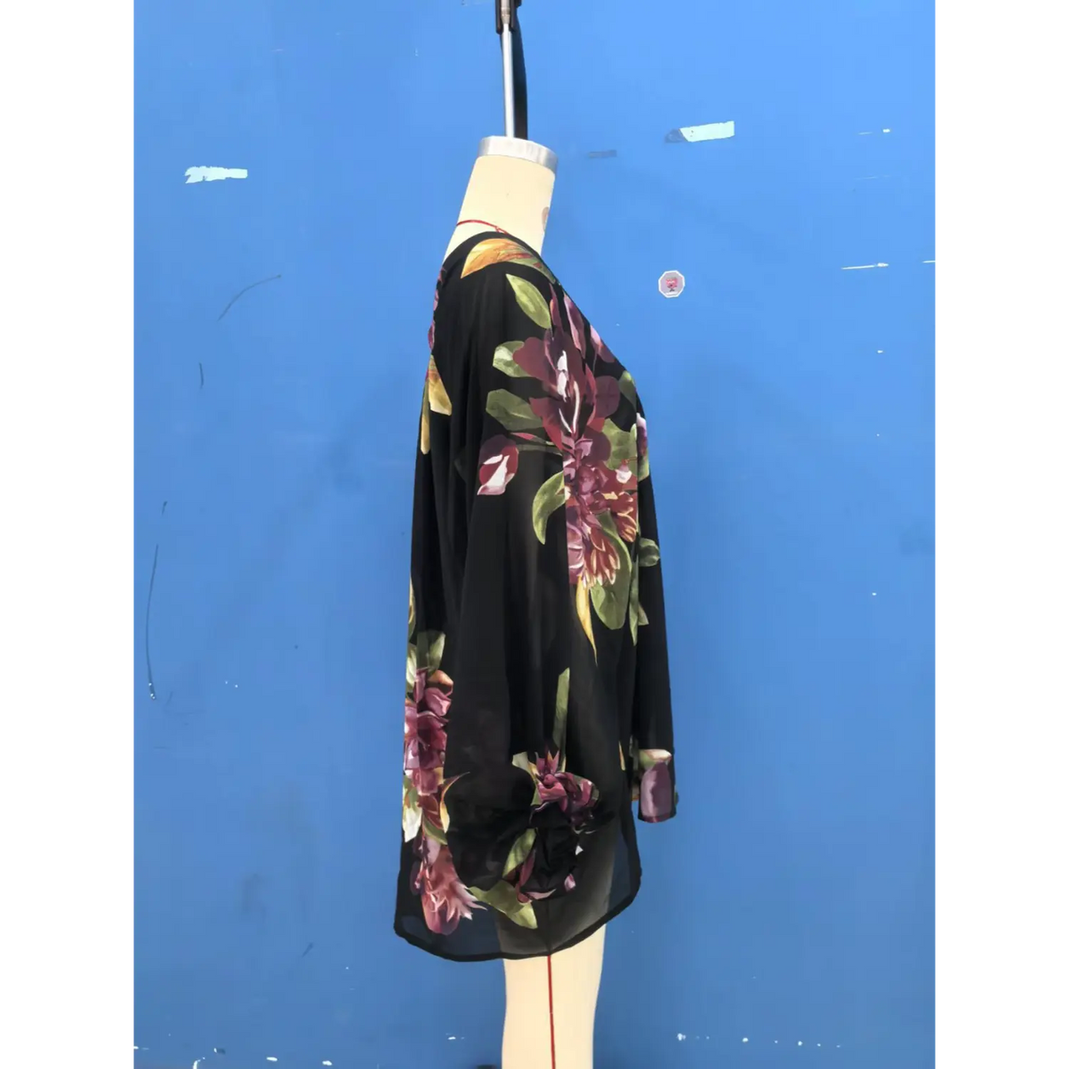 Mannequin side view of floral print blouse